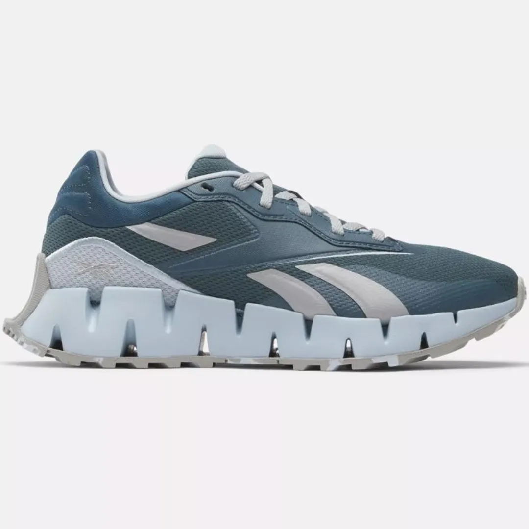 A single blue athletic shoe with prominent white stripes and a chunky tread design.