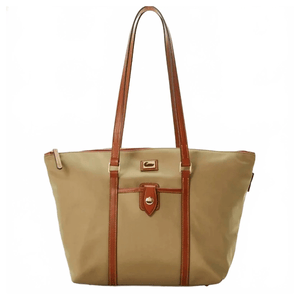 A tan tote bag with brown leather straps and trim, featuring a front pocket with a gold clasp.