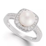 Silver ring featuring a central pearl surrounded by small sparkling stones arranged in a square halo design, with additional small stones set into the band.