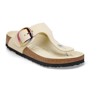 A single beige Birkenstock sandal with a large adjustable buckle.