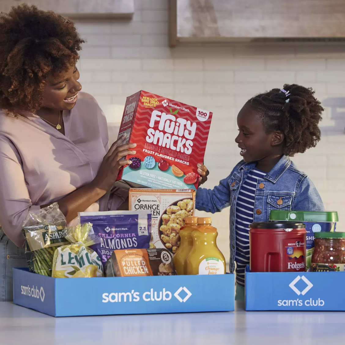 A Sam's Club 1-Year Membership includes access to bulk groceries like Fruity Snacks, Orange Chicken, almonds, pulled chicken, lemon juice, asparagus, orange juice, coffee, and salsa.