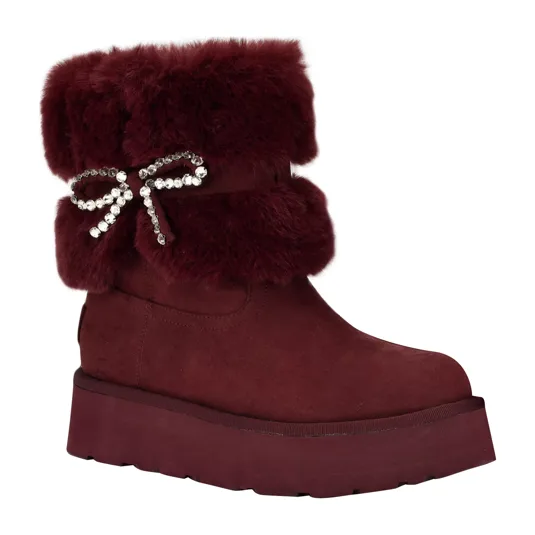 Plum-colored boot with faux fur trim and a jeweled bow accent, featuring a platform sole.
