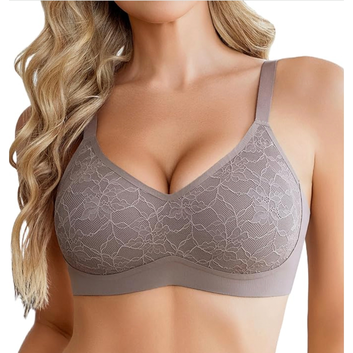A woman wearing a taupe lace bra with wide straps and floral lace overlay, featuring full coverage and no underwire.
