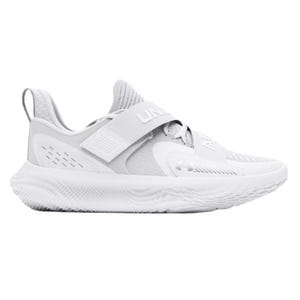 White athletic sneaker with a textured sole, featuring a strap labeled \“UA\“ across the top for secure fit.