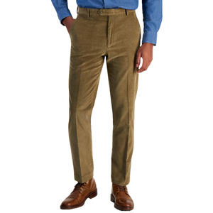 Tan corduroy pants by Tommy Hilfiger featuring a tailored fit, button closure, and side pockets, paired with brown leather dress shoes and a blue dress shirt.