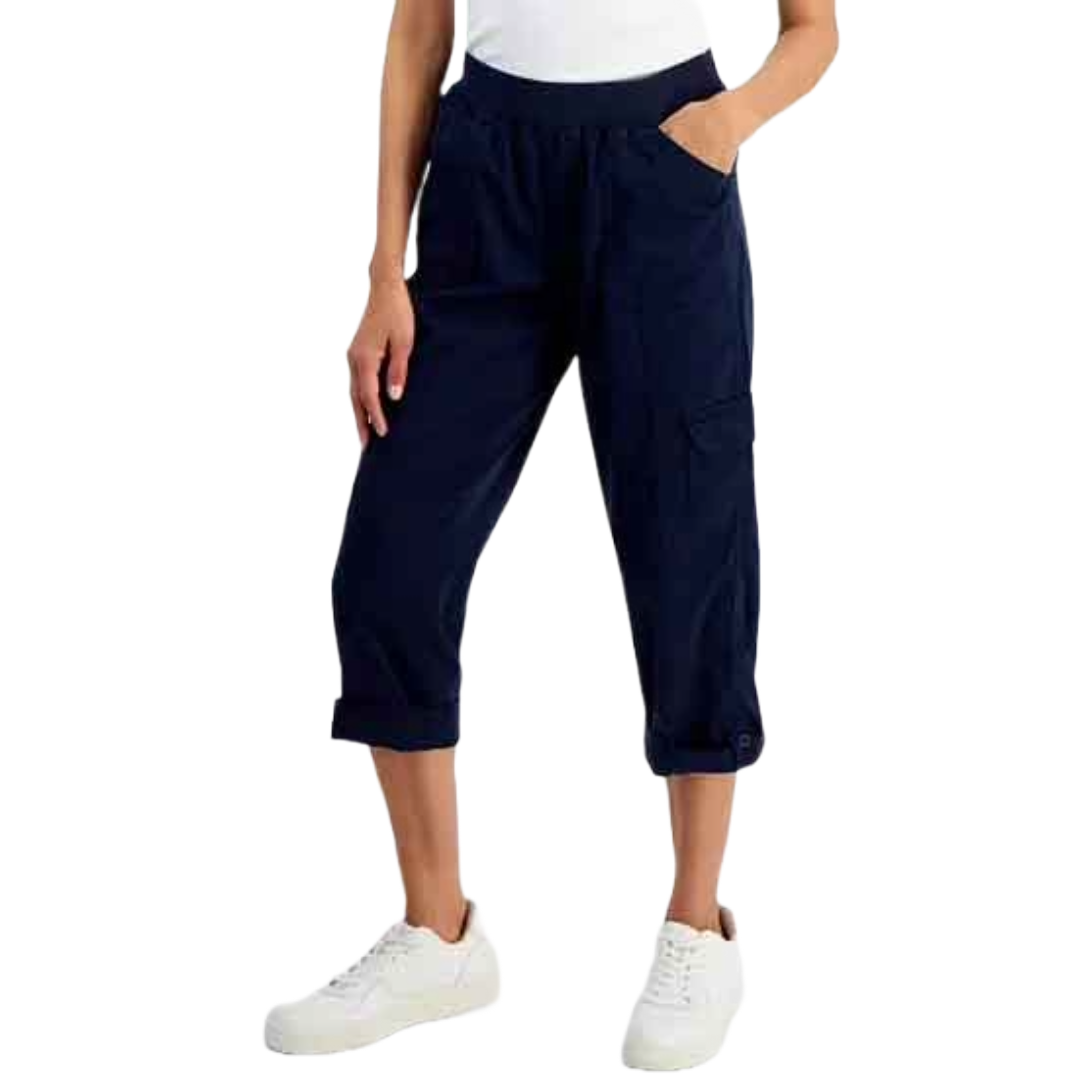 Blue cropped cargo pants paired with white sneakers.