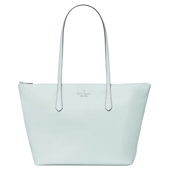 A light blue tote bag with two long handles and a zippered top, featuring a small logo in the center.
