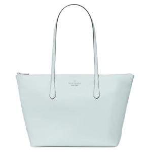 A light blue tote bag with two long handles and a zippered top, featuring a small logo in the center.
