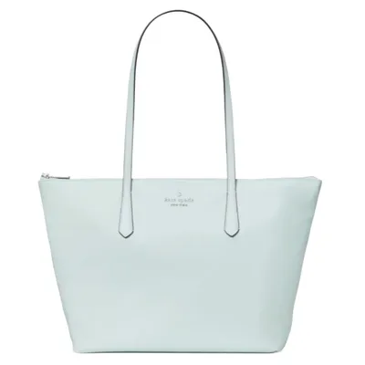 A light blue tote bag with two long handles and a zippered top, featuring a small logo in the center.