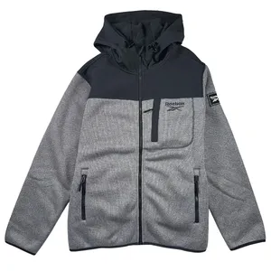 Gray Reebok hoodie with a black upper panel and hood, featuring a front zipper, chest and side pockets, and a logo on the chest and sleeve.
