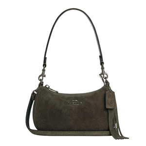 A small olive green suede handbag with a detachable shoulder strap, fringe detail, and a brand logo on the front.