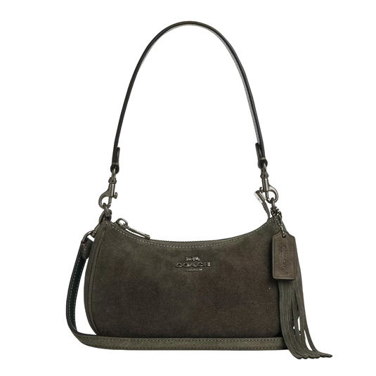 A small olive green suede handbag with a detachable shoulder strap, fringe detail, and a brand logo on the front.