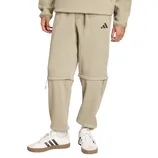 Beige Adidas pants with a zip-off design, transitioning them into shorts. Paired with white Adidas sneakers featuring black stripes.