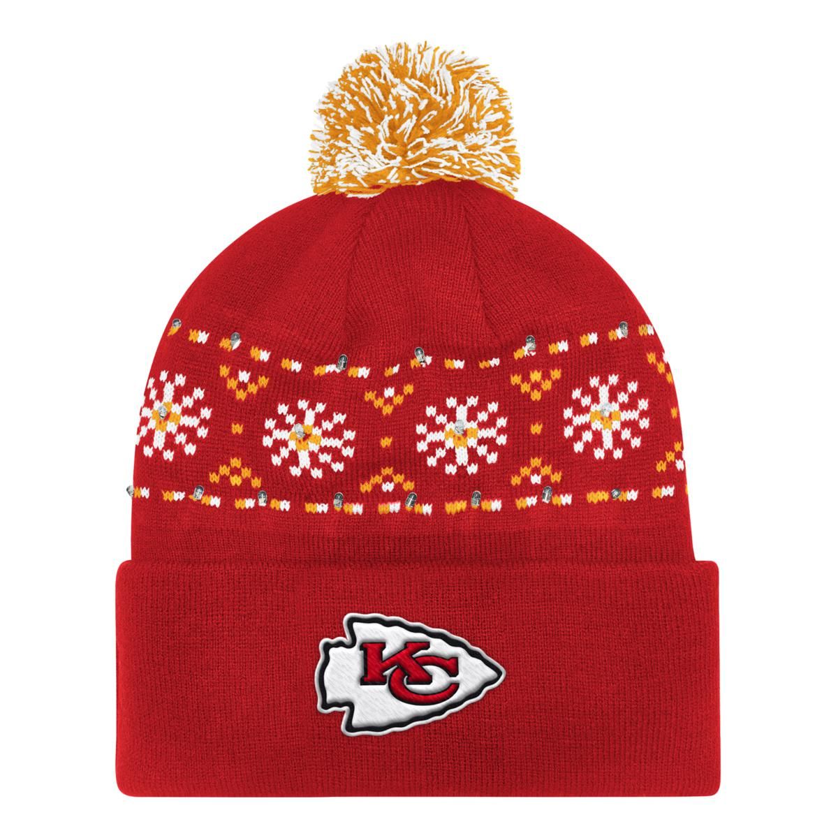 A red beanie with a pom-pom on top features a Kansas City Chiefs logo and a patterned yellow and white stripe with embedded lights.