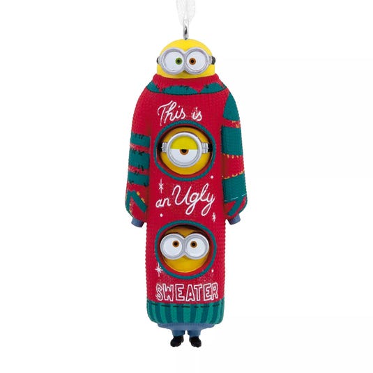 Christmas ornament featuring three Minions wearing a red and green ugly sweater with the text \“This is an Ugly Sweater.\“