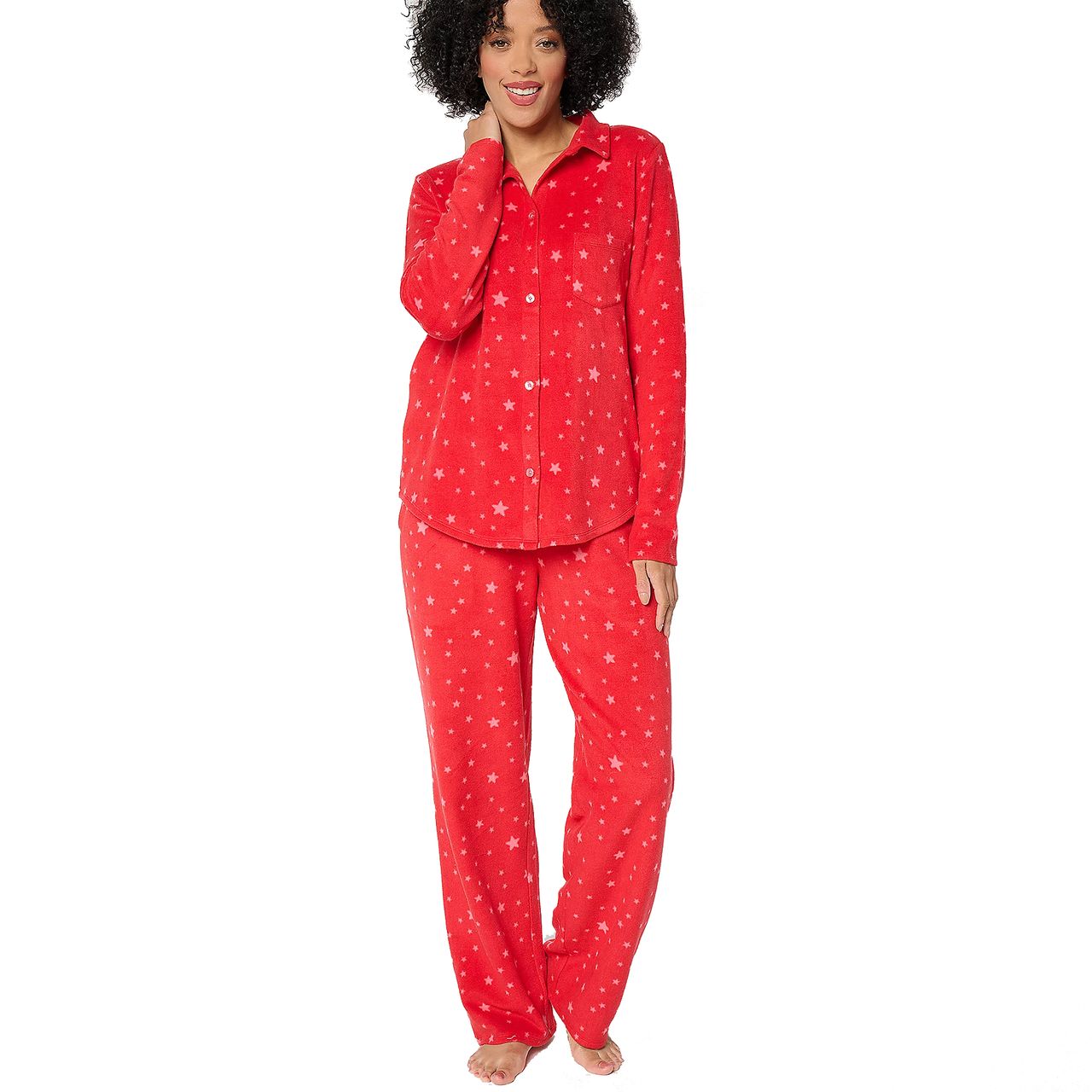 Red polyester fleece pajama set with white stars, featuring a button-up long-sleeve top and matching pants.