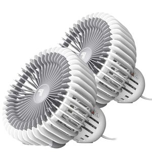 The 2pk Vornado Desktop Fans are compact, cylindrical fans with a white and gray design, featuring circular grills for effective airflow. Each fan is designed for tabletop use and includes a power cord.