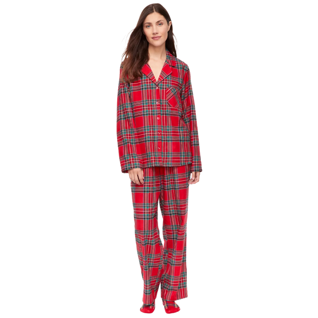Red plaid flannel pajamas with a button-up top featuring a notched collar and a chest pocket, paired with matching full-length pants and red slippers.