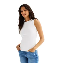 A woman is wearing a white sleeveless high-neck tank top paired with blue jeans. The tank top has a fitted design, perfect for layering, and the jeans have a casual, slightly distressed look.