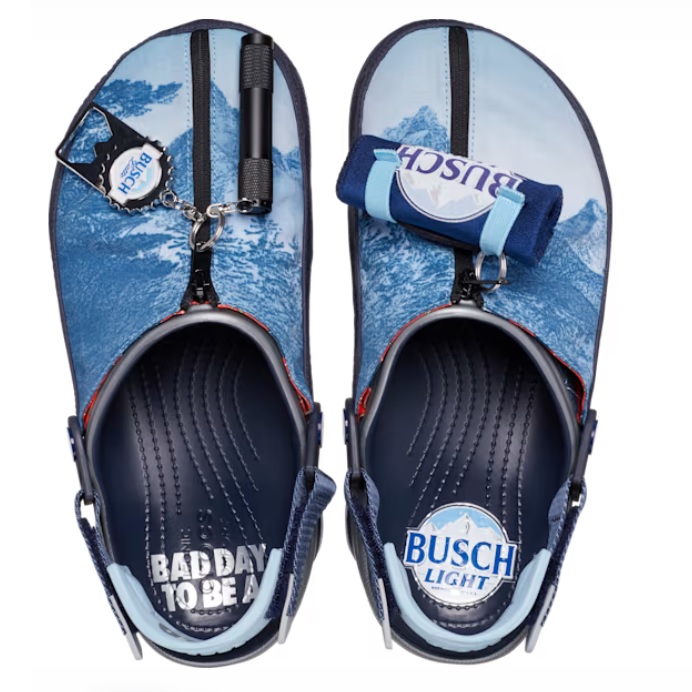 A pair of flip-flops with Busch Light beer branding and a bottle opener attached to one strap.
