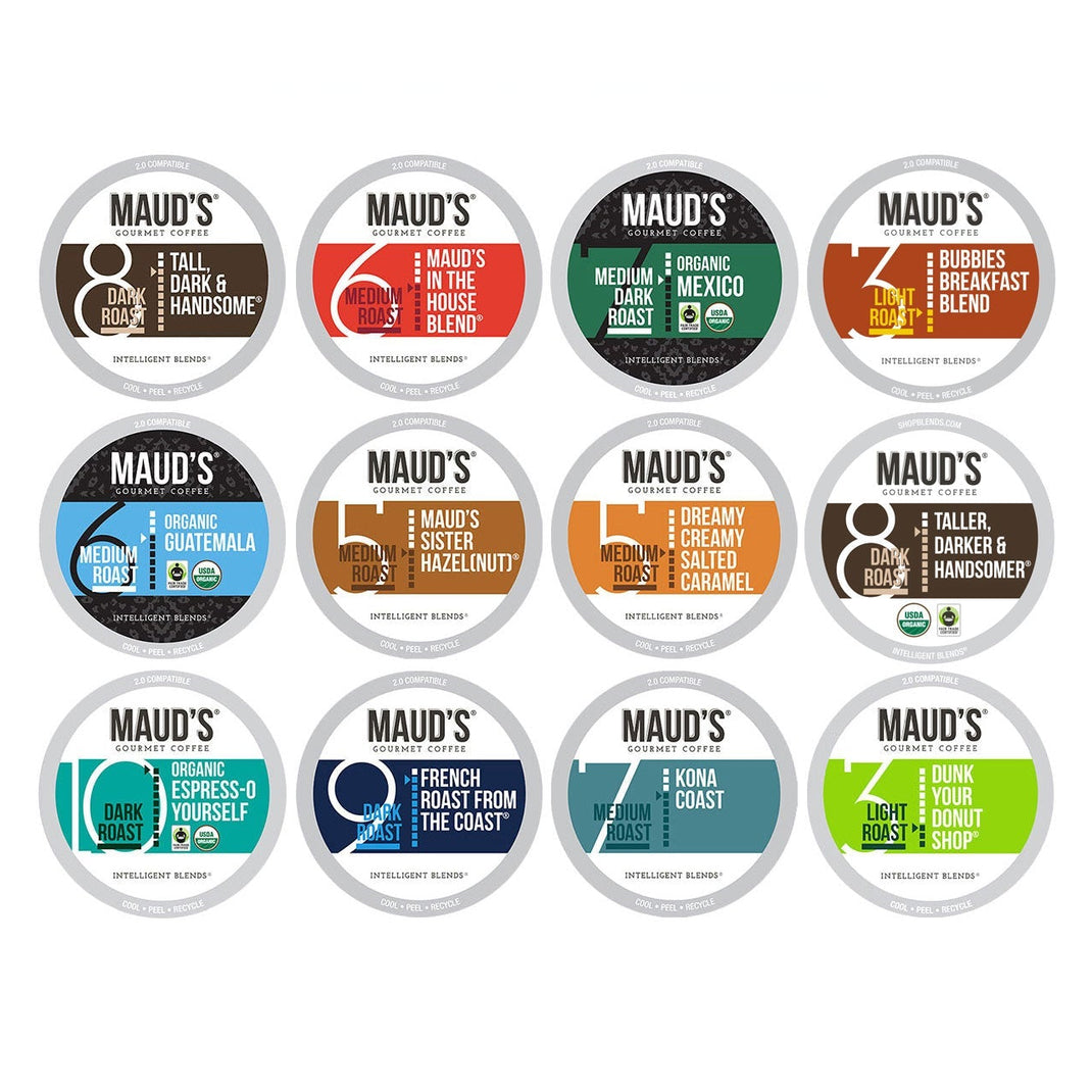 A collection of Maud's Coffee Pod Packs with various flavors such as dark roast, medium roast, organic blends, flavored coffees like hazelnut and caramel, and breakfast blends.