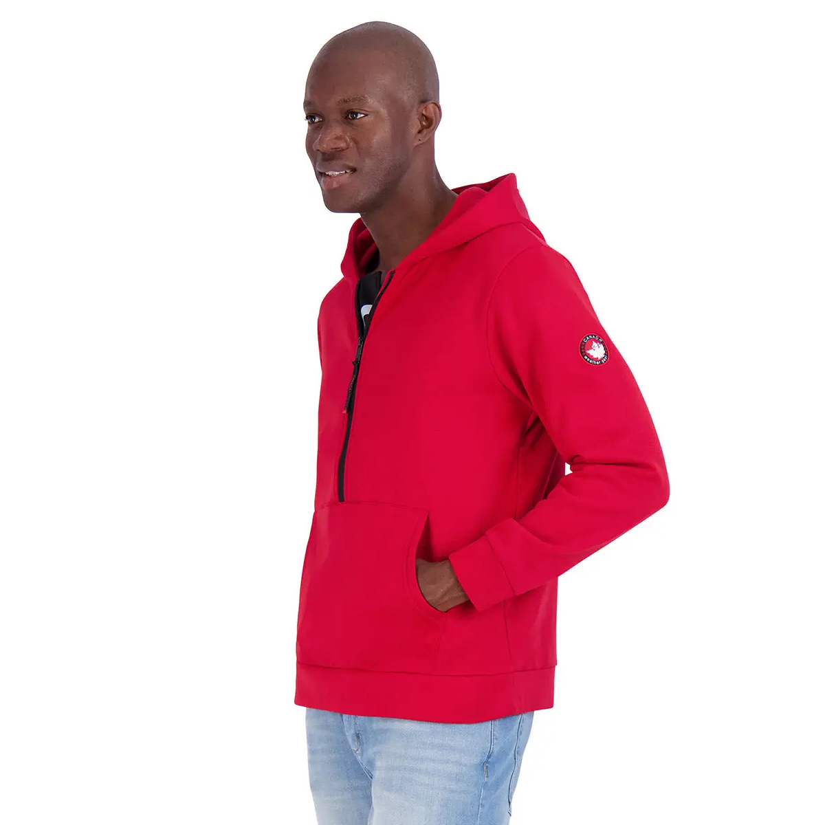 Red half-zip hoodie with a Canada Weather patch on the sleeve, featuring a front kangaroo pocket and hood, paired with light blue jeans.