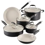 A 10-piece cookware set featuring various pots and pans with lids, in a black exterior and white interior, including different sizes of frying pans, saucepans, and stockpots.