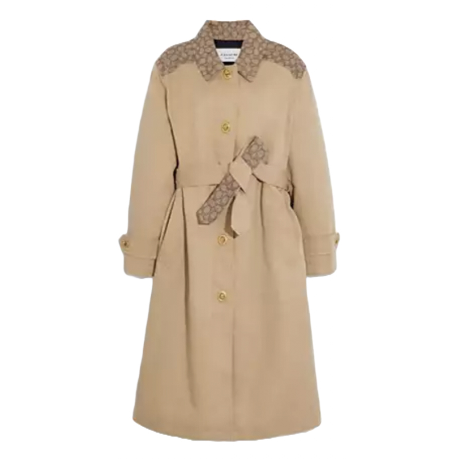 Beige long trench coat with button closure, featuring monogram accents on the shoulders and a matching monogram belt.