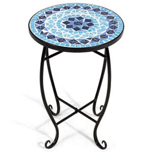 Round accent table with intricately designed blue mosaic tile top and sturdy black metal scroll legs.