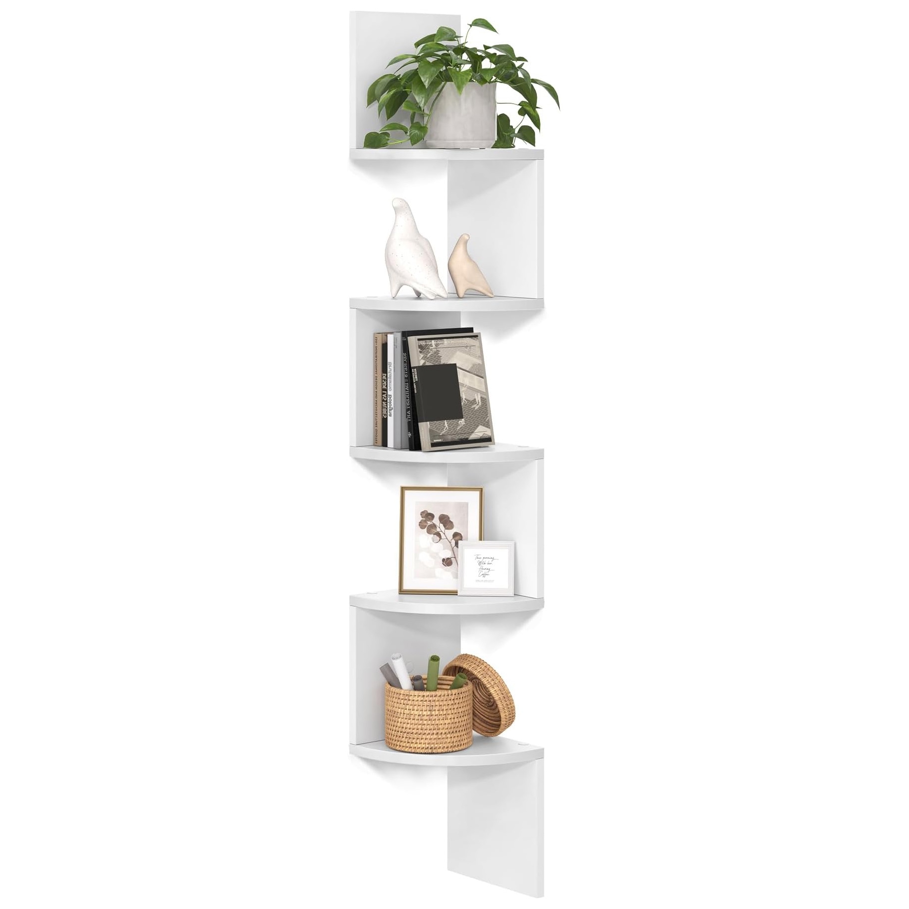 A white floating corner bookshelf with five triangular shelves, featuring a plant, decorative birds, books, framed art, and a wicker basket. Designed to fit snugly into a corner, maximizing vertical storage space.