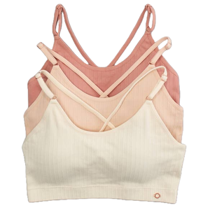 Three ribbed bralettes in shades of pink and cream with adjustable straps and a cross-back design are stacked together.