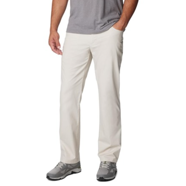 A person is wearing light-colored pants with a straight fit, paired with a gray T-shirt and gray sneakers.
