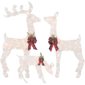 Set of three light-up reindeer decorations adorned with red plaid bows and evergreen sprigs.