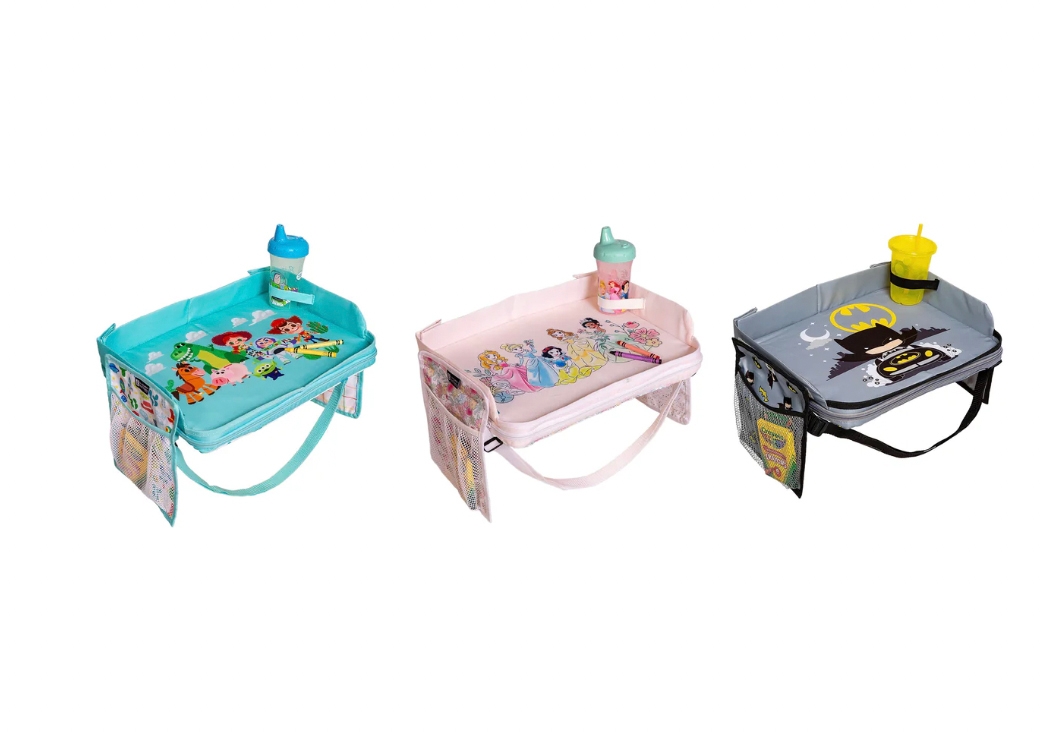 Three children's tray booster seats with cartoon themes: Paw Patrol in blue, Disney Princess in pink, and Batman in gray. Each has a cup and side pockets.