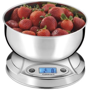 A stainless steel bowl filled with strawberries sits on a digital Cuisinart kitchen scale, displaying a weight of 2 lb 8 oz. The scale has an on/off button and mode/tare button.