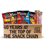 Box featuring Jack Link's snacks, including Beef Tender Bites, Sweet & Hot Beef Jerky, Teriyaki Beef Jerky, and Duos flavors. Text highlights \“40 years at the top of the snack chain.\“