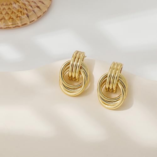 Gold-toned hoop earrings featuring multiple interlocking loops with a shiny finish, elegantly displayed against a neutral background.