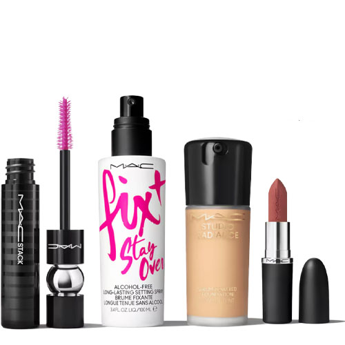 The 4-piece MAC Makeup Set includes a black MAC Stack mascara with a pink brush, a Fix+ Stay Over setting spray, a Studio Radiance foundation, and a bullet-shaped lipstick in a nude shade.