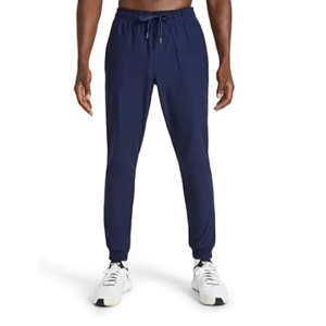 Navy blue jogger pants with a drawstring waist, worn by a person paired with white sneakers.