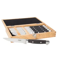A wooden box contains a set of serrated steak knives with black handles, each knife featuring \“Viking\“ branding.