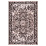 A rectangular, intricately patterned area rug featuring a traditional design with earthy tones of brown and beige and a detailed border.