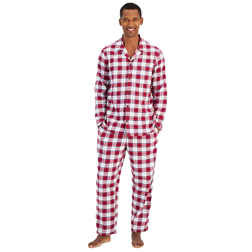A man is wearing a red and white checkered two-piece flannel pajama set with a collared top and long pants.
