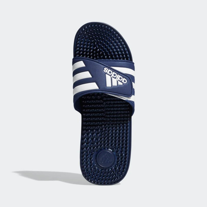 A single navy blue sports slide with white stripes across the strap.