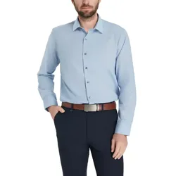 A man is wearing a light blue button-up shirt with long sleeves, paired with dark trousers and a brown belt.