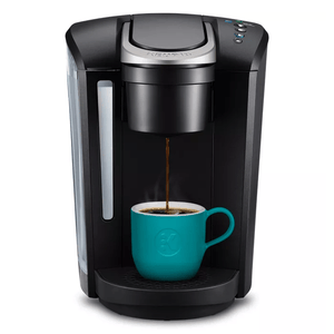 The Keurig K-Select Coffee Maker is a sleek, black single-serve brewer featuring simple button controls for brewing coffee. It has a large water reservoir on the side and brews directly into a cup or mug.