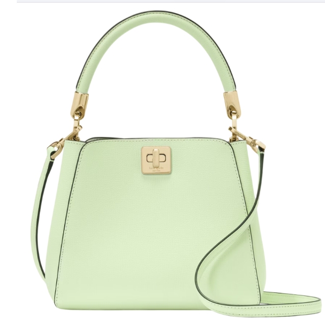A light green handbag with a structured design, featuring a top handle, a gold-tone square clasp, and a detachable shoulder strap.