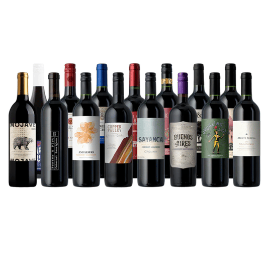 A selection of thirteen bottles of red wine from various brands, featuring labels with different designs including bears, abstract art, and figures.