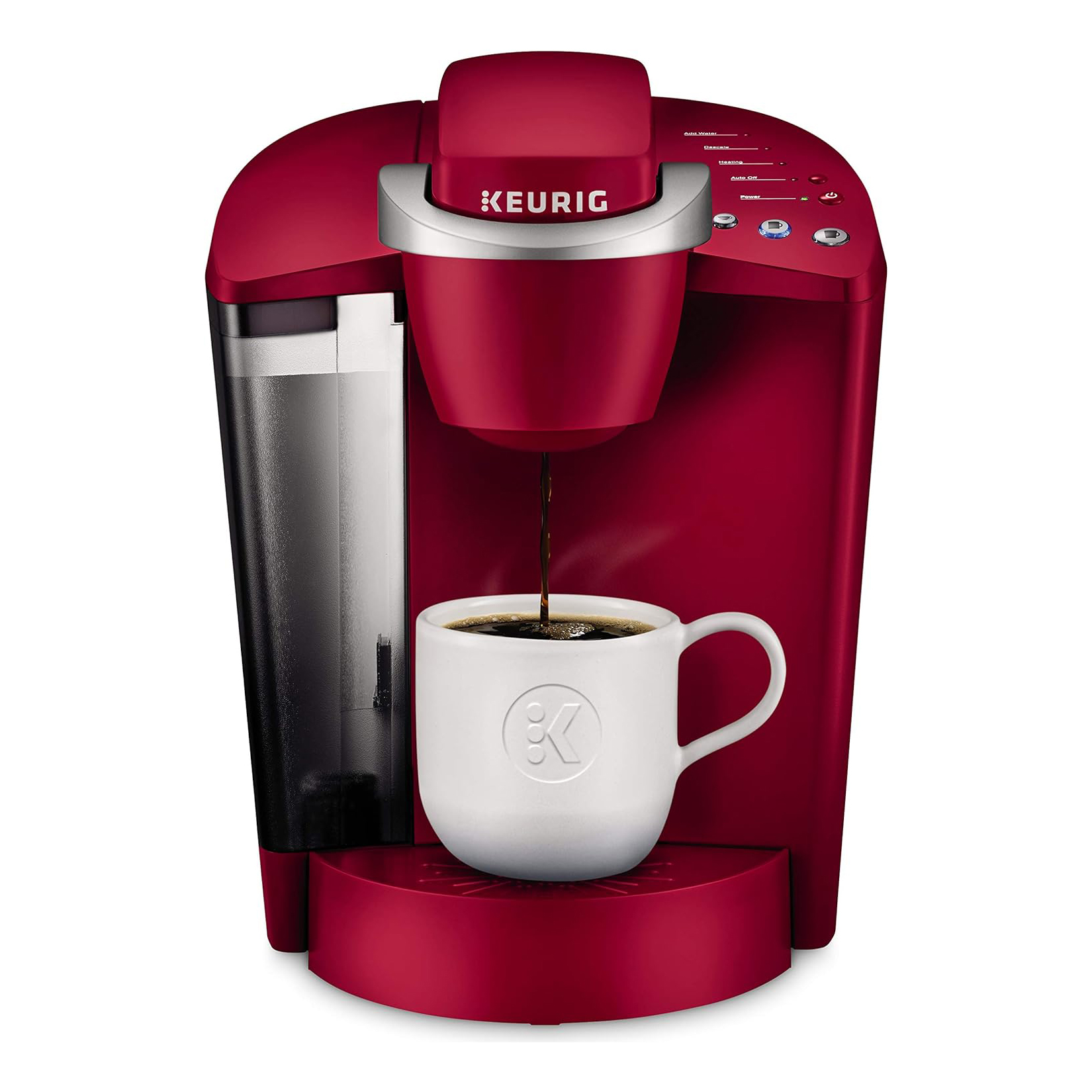 A red Keurig single-cup coffee maker dispensing coffee into a white mug.