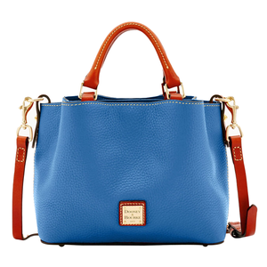 A blue Dooney & Bourke leather tote bag with tan handles and a detachable shoulder strap. It features gold-tone hardware and a logo patch on the front.