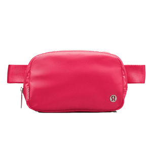 A bright pink Lululemon belt bag with a sleek design, featuring a zipper compartment, adjustable strap, and the Lululemon logo.
